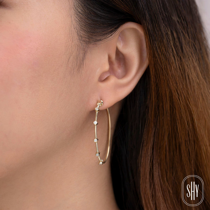 0.27CT DIAMOND BEZEL HOOP EARRING