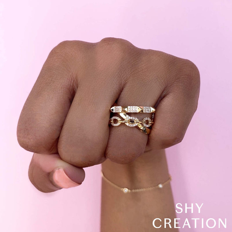 0.22CT DIAMOND PYRAMID LINK RING