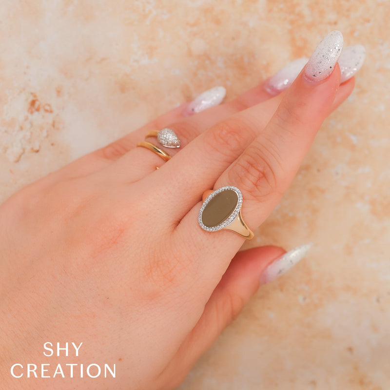 0.11CT DIAMOND OVAL RING